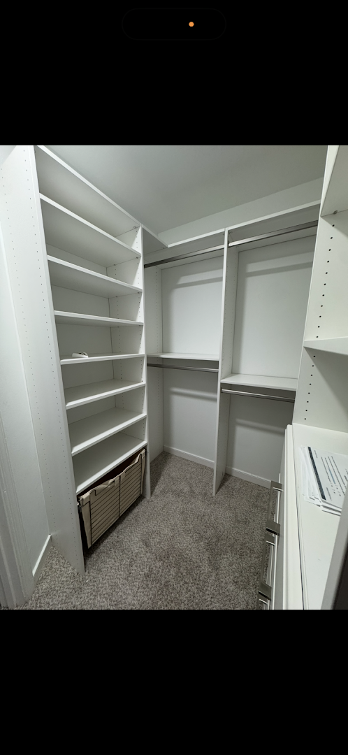 White custom closet system with shelving and double hanging rods